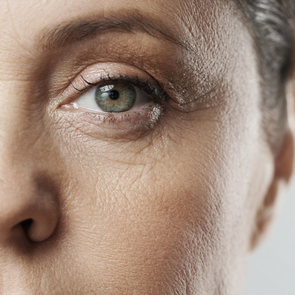 Middle aged woman's eye with wrinkles