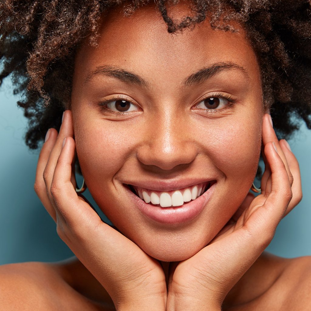 Woman with curly hair smiling