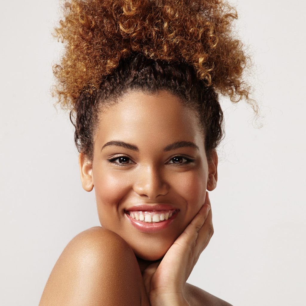 Woman with curly hair smiling