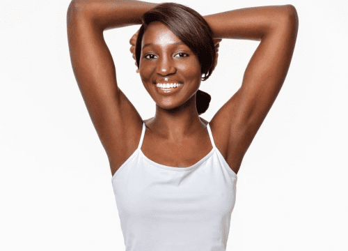 dark-skinned Woman showing off her hairless armpits