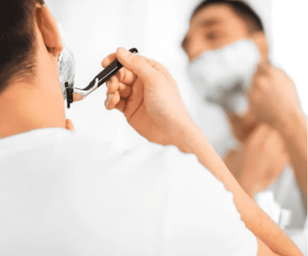 Man shaving his face