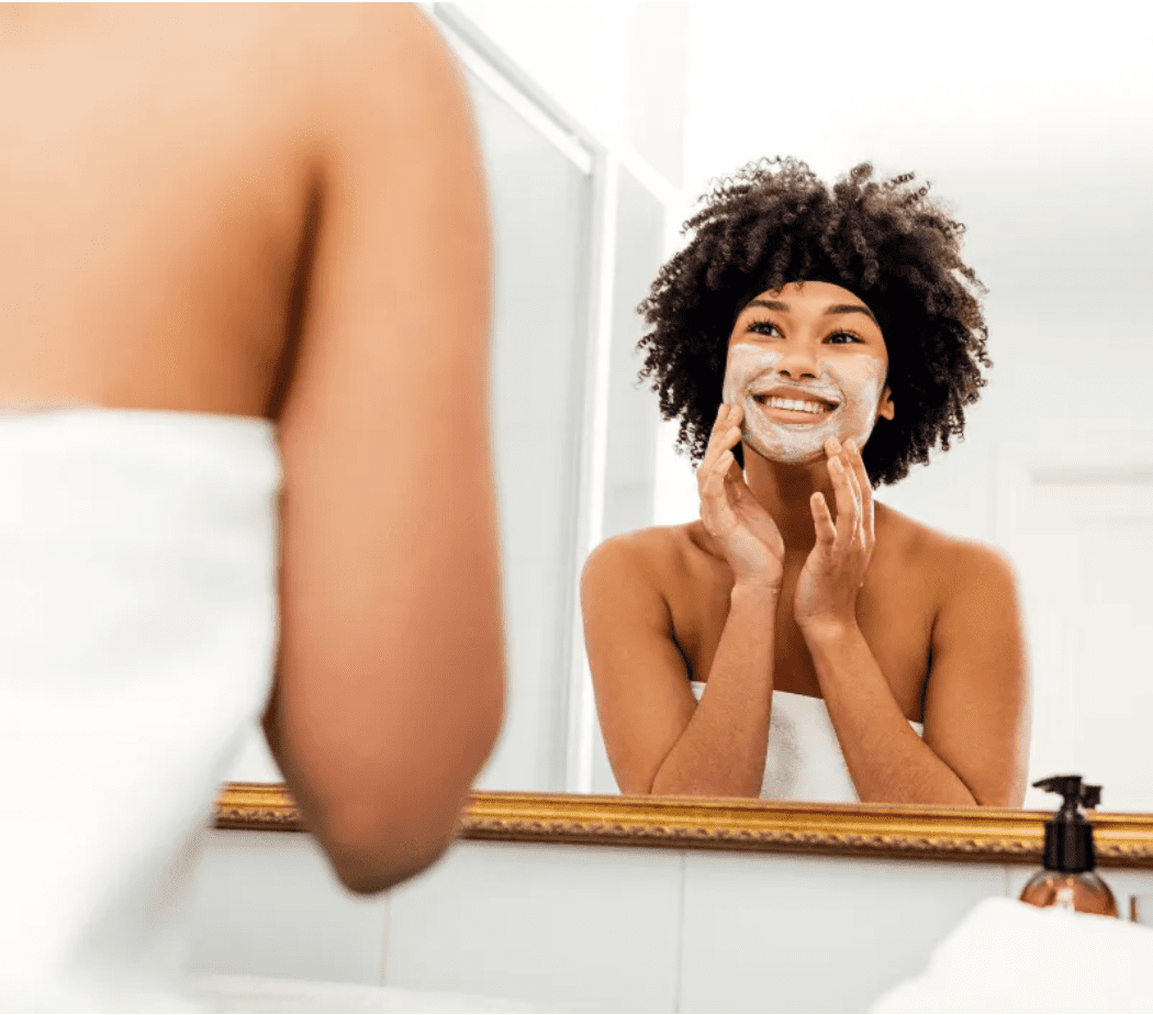 Woman washing her face